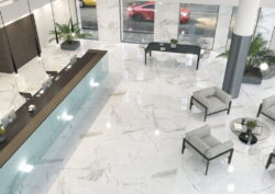 Płytki imitujące marmur w salonie 120x120 - Cifre Statuario Pulido. Salon z podłogą pokrytą białymi płytkami gres, imitującymi marmur z szarymi żyłkami i błyszczącą powierzchnią.