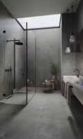 Szara łazienka z hiszpańskimi płytkami imitującymi beton na podłodze i ścianie - APE Work b coal.