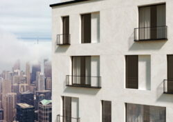 Płytki z imitacją kamienia - Peronda Museum CHICAGO CLOUD. Elewacja budynku w płytkach imitujących kamień w odcieniach bieli.