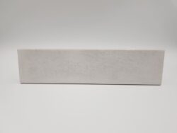 Szare kafelki cegiełki - Harmony Bari Silver 6x24,6 cm. Płytki w małym, podłużnym formacie z błyszczącą, przecieraną powierzchnią, lekko wklęsłą.